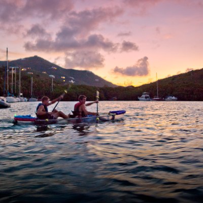 two clients paddling in the sunset of St. Criox