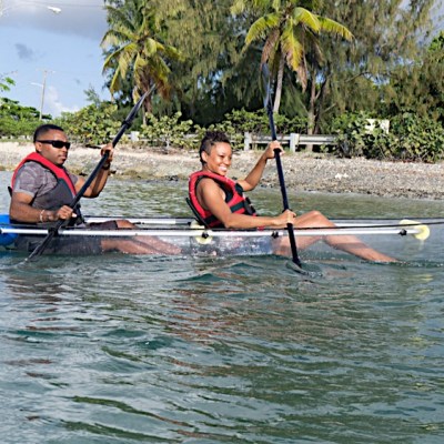 customers in clear kayaks during the day